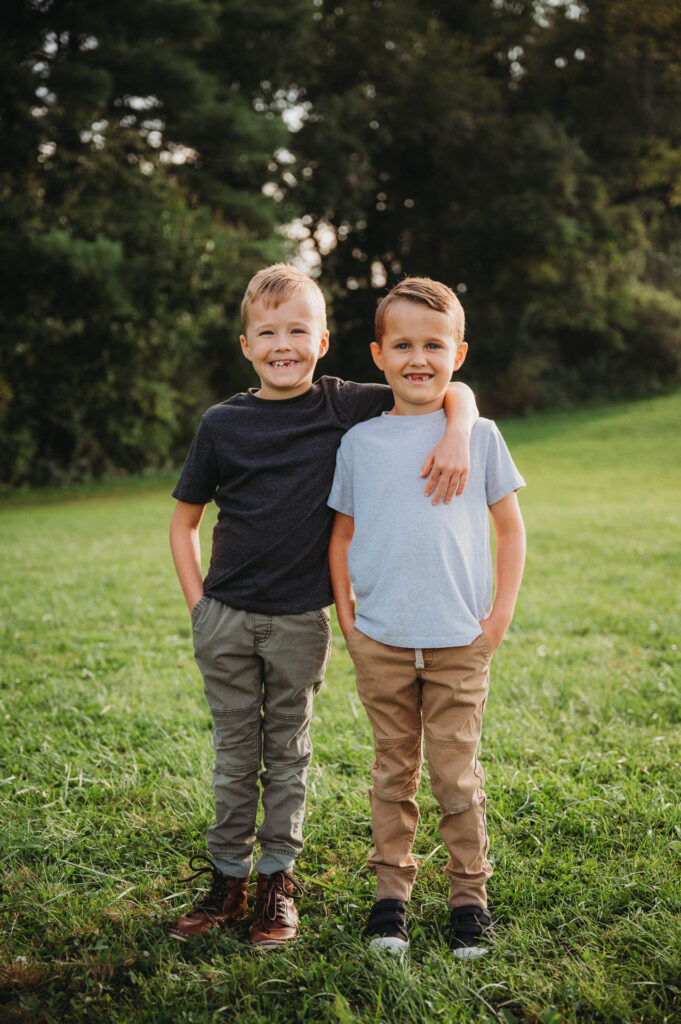 Johnson boys posing during family photos at freer field in ashland ohio