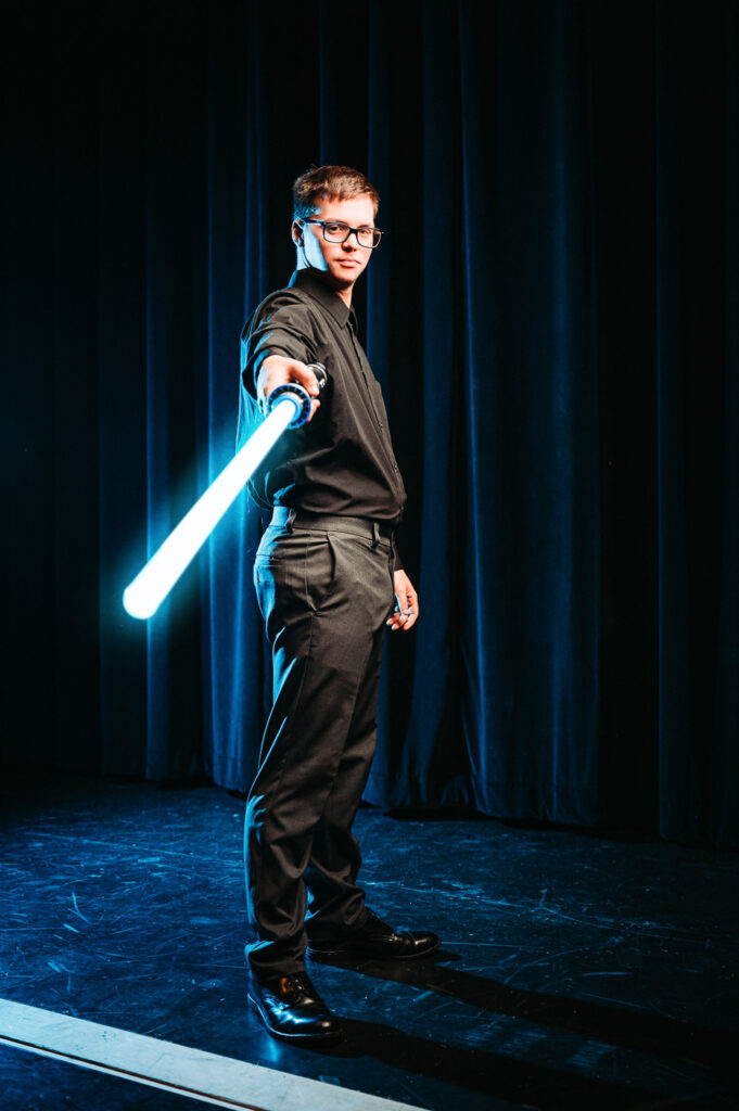 Senior Picture Ideas with Lightsaber Star Wars Theme featuring Cooper Sanders